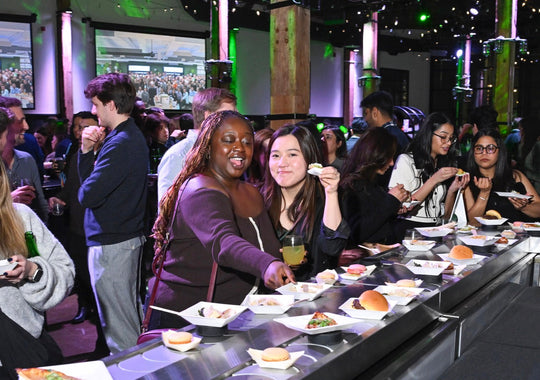 Happy people enjoying food at a Steamwhistle event