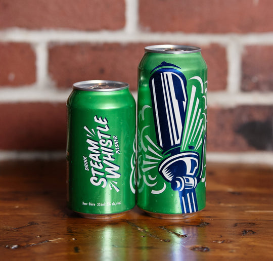 Two cans of Steam Whistle pilsner